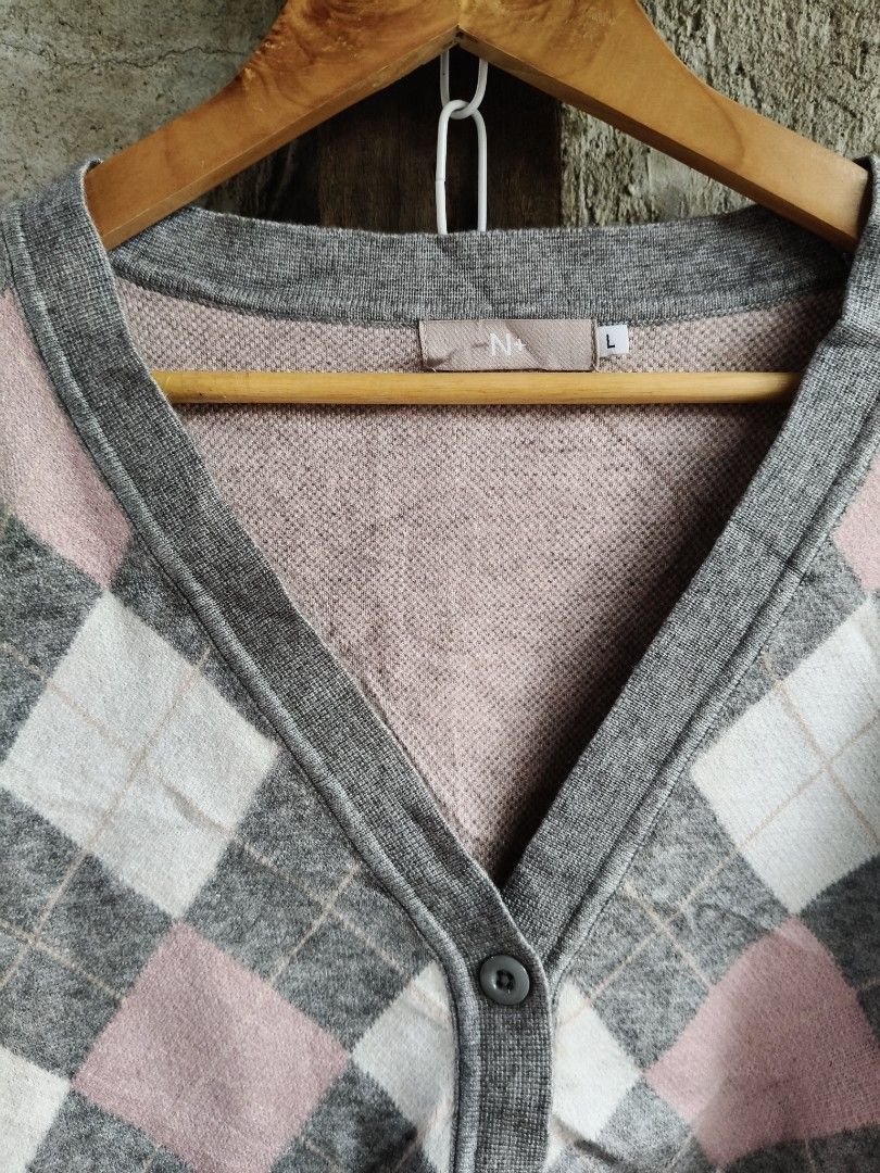 N+ Grey Pink Argyle Pattern Cardigan Size L (Category: Coats, Jackets and Outerwear) located in Bulacan. Submitted by theroadthrift (Listing ID 1471086469, Image 2). Description: - Style: V-neck button-front cardigan - Design: Pink and white argyle diamond pattern on grey knit - Size: L (label at inner collar) - Features: Soft fabric, ribbed cuffs and hem - Condition: Great for layering or standalone wear.