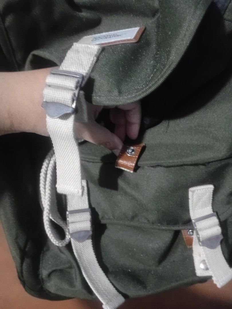 National Geographic Green Canvas Backpack (Category: Backpacks) located in Cainta. Submitted by 2ndhandtoGo (Listing ID 1471009861, Image 2). Description: Broken button lock but still usable - Brand: National Geographic - Material: Sturdy green canvas with beige straps - Closure: Drawstring with metal buckles and front flap - Pockets: Front flap pocket and dual side pockets - Straps: Adjustable padded shoulder straps with branded patch detail - C