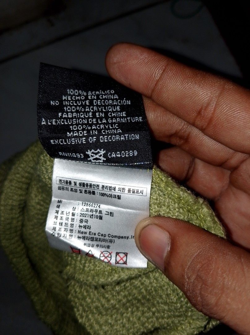 New Era Sprout Green Beanie (Category: Caps & Hats) located in Kapalong. Submitted by aliclothesfinds21 (Listing ID 1471045458, Image 3). Description: - Brand: New Era - Color: Sprout Green - Material: 100% Acrylic (warm and cozy) - Design: Embroidered New Era flag logo on the front - Origin: Made in China - Details: Clean knit fabric, internal tags with product code 12866274 and Oct 2021 mfg date.