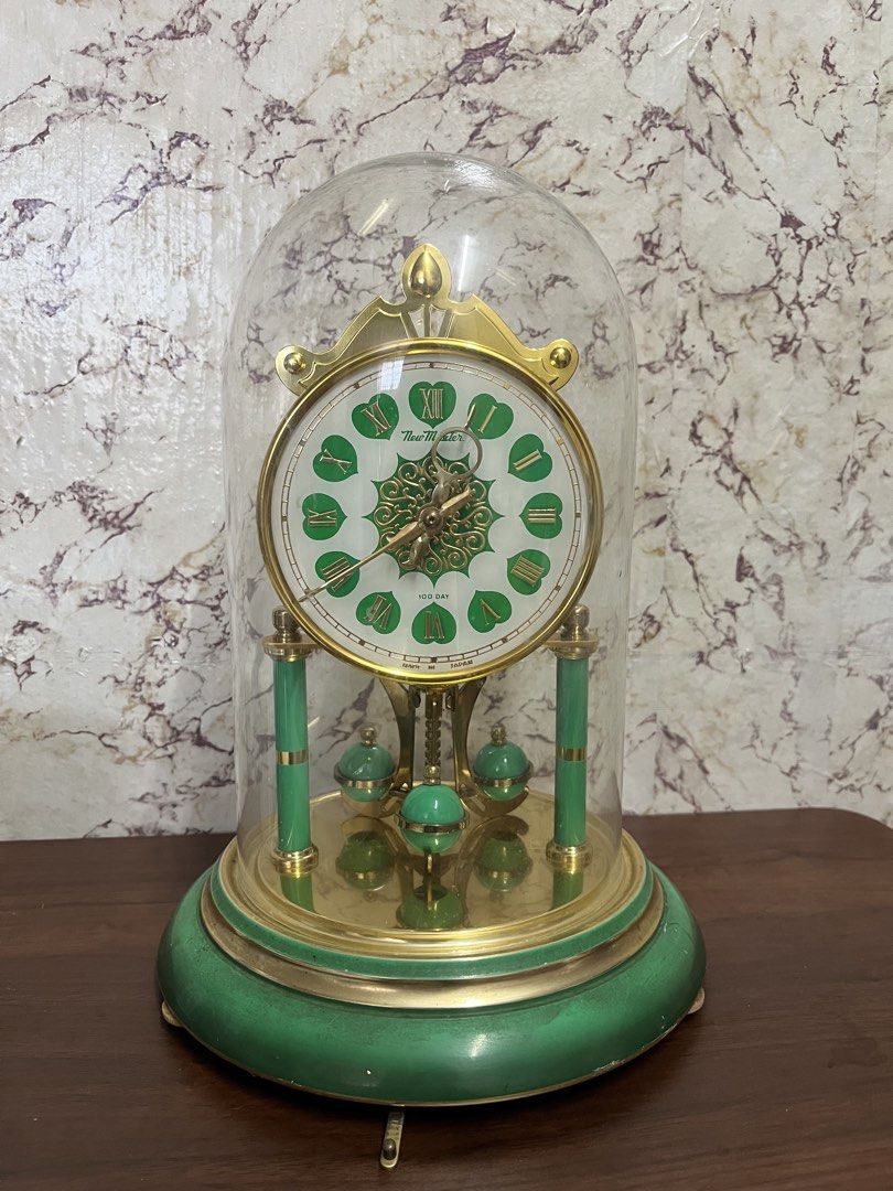 New Master 100 Day Glass Dome Anniversary Clock (Category: Clocks) located in Manila. Submitted by kayerrr.gem (Listing ID 1471073218, Image 1). Description: FOR SALE!!! Vintage Green & Gold 100-Day Pendulum Clock A lovely display piece for vintage collectors and antique enthusiasts! - Elegant green and gold finish - Classic Roman numeral dial - Decorative pendulum and dome design Condition: NOT WORKING / FOR DISPLAY OR RESTORATION (Sold as is.) 