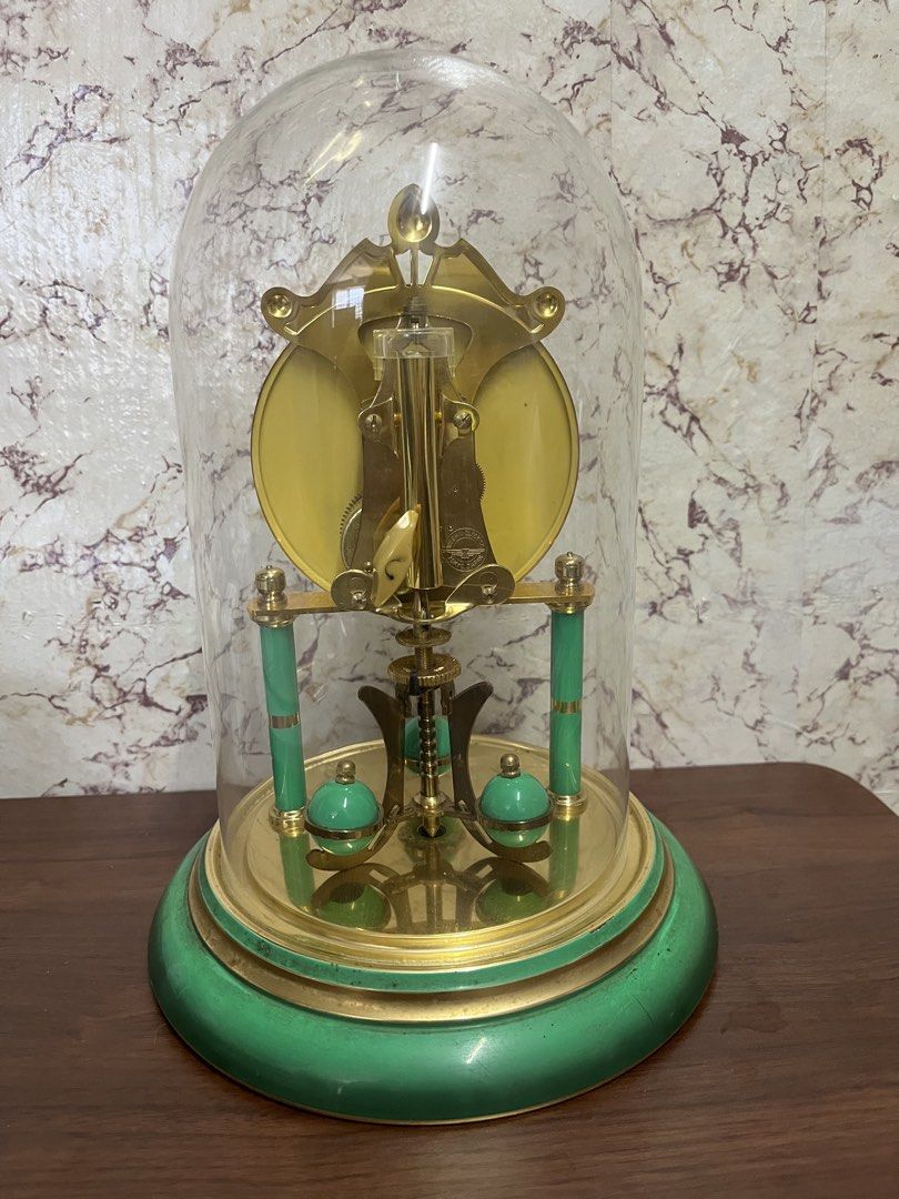 New Master 100 Day Glass Dome Anniversary Clock (Category: Clocks) located in Manila. Submitted by kayerrr.gem (Listing ID 1471073218, Image 2). Description: FOR SALE!!! Vintage Green & Gold 100-Day Pendulum Clock A lovely display piece for vintage collectors and antique enthusiasts! - Elegant green and gold finish - Classic Roman numeral dial - Decorative pendulum and dome design Condition: NOT WORKING / FOR DISPLAY OR RESTORATION (Sold as is.) 