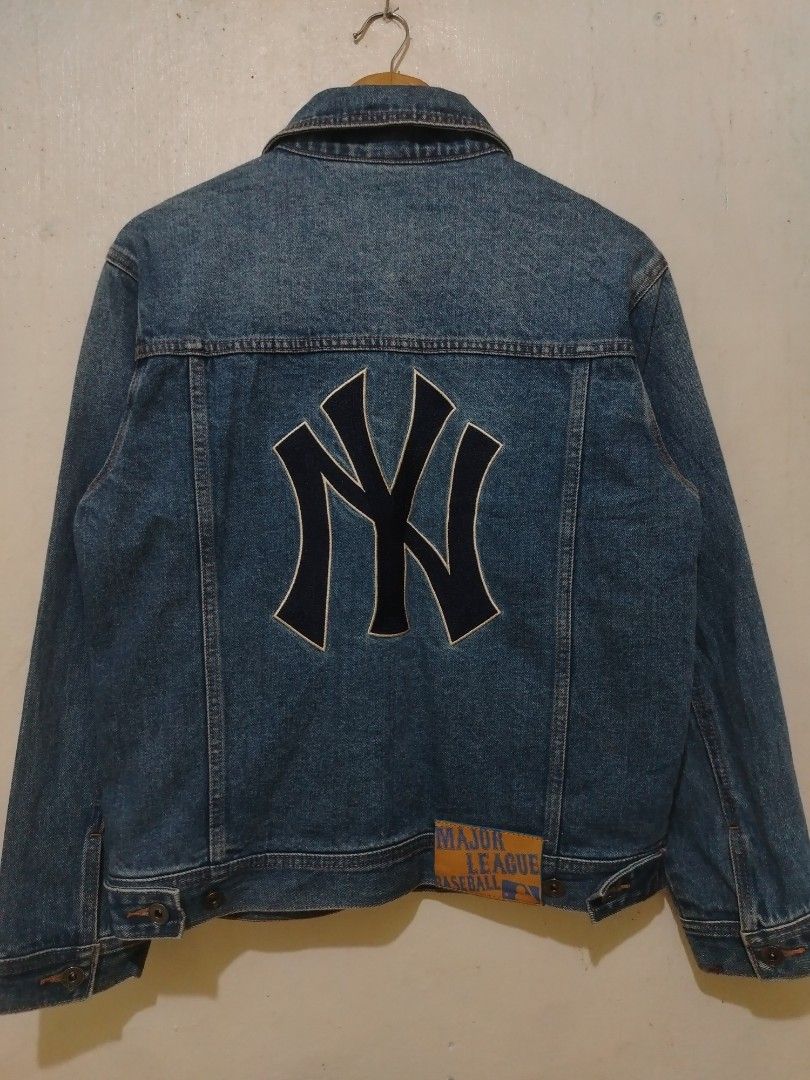 New York Yankees MLB Denim Jacket (Category: Coats, Jackets and Outerwear) located in Rizal. Submitted by gmpastoffi75031 (Listing ID 1470969443, Image 1). Description: - Official MLB New York Yankees merchandise - dimes 21x25 - Classic blue denim jacket design - Large embroidered NY logo on the back and small logo on the front chest - Button-up front closure - Functional chest and side pockets - Great layering piece for cool weather - Condition: