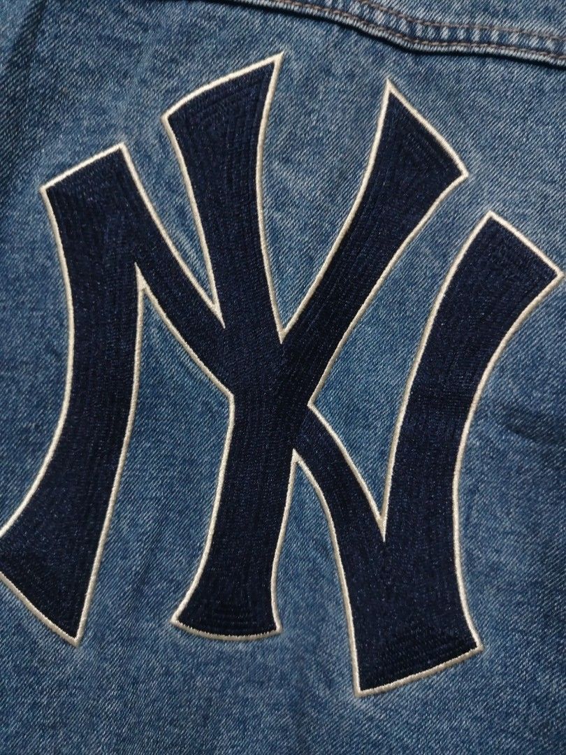 New York Yankees MLB Denim Jacket (Category: Coats, Jackets and Outerwear) located in Rizal. Submitted by gmpastoffi75031 (Listing ID 1470969443, Image 3). Description: - Official MLB New York Yankees merchandise - dimes 21x25 - Classic blue denim jacket design - Large embroidered NY logo on the back and small logo on the front chest - Button-up front closure - Functional chest and side pockets - Great layering piece for cool weather - Condition: