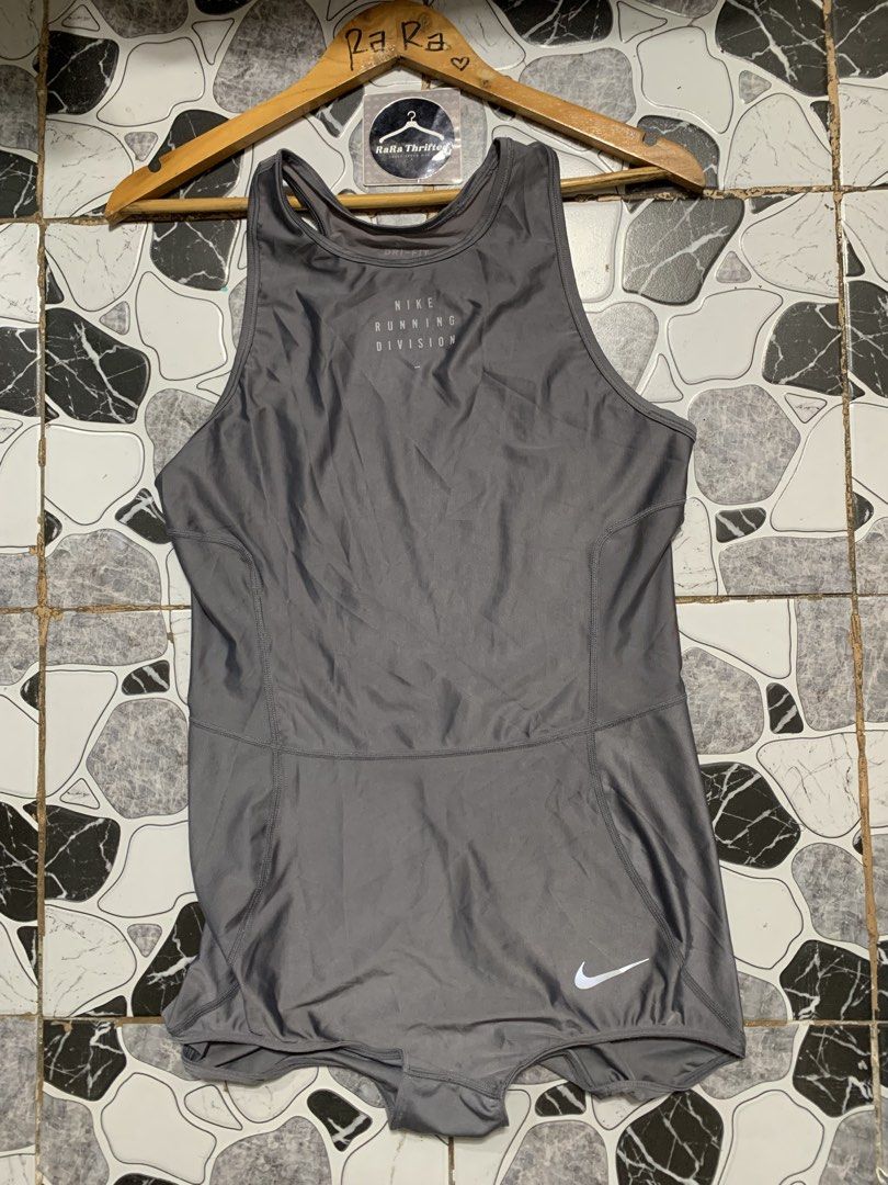 Nike | bodysuit tech / womens large (Category: Activewear) located in Cebu City. Submitted by rarathriftedcb (Listing ID 1471038492, Image 2). Description: Nike ✅ Running division Body suit 🩶 Mettalic grey silver Run , Gym , Dance & Cheer Cycling & spin .. versatile Large tag 🏷️ Reflectorize Running division Font script & Swoosh logo Front / lower 1,500pesos + sf 95 Location : cebu city Page : rara thrifted Jnt nationwide Message us 📩.