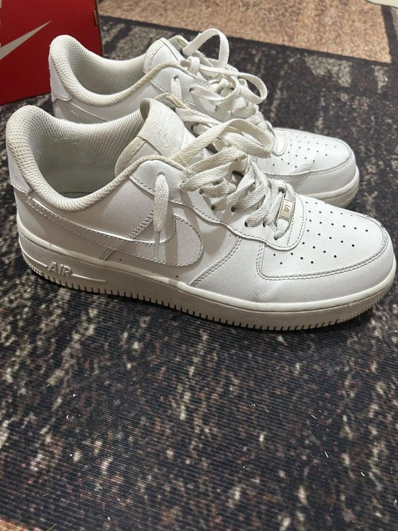 Nike Air Force 1 Low Triple White (Category: Sneakers) located in Manila. Submitted by andrew1517 (Listing ID 1471042487, Image 1). Description: - Brand: Nike - Style: Classic All-White Low Top Sneakers - Features: Crisp leather upper, perforated toe box, chunky rubber sole with Air cushioning, and silver AF1 lace dubraes - Inclusions: Original box included - Condition: Pre-owned with minor crease lines on the toe box and normal signs of wear on 