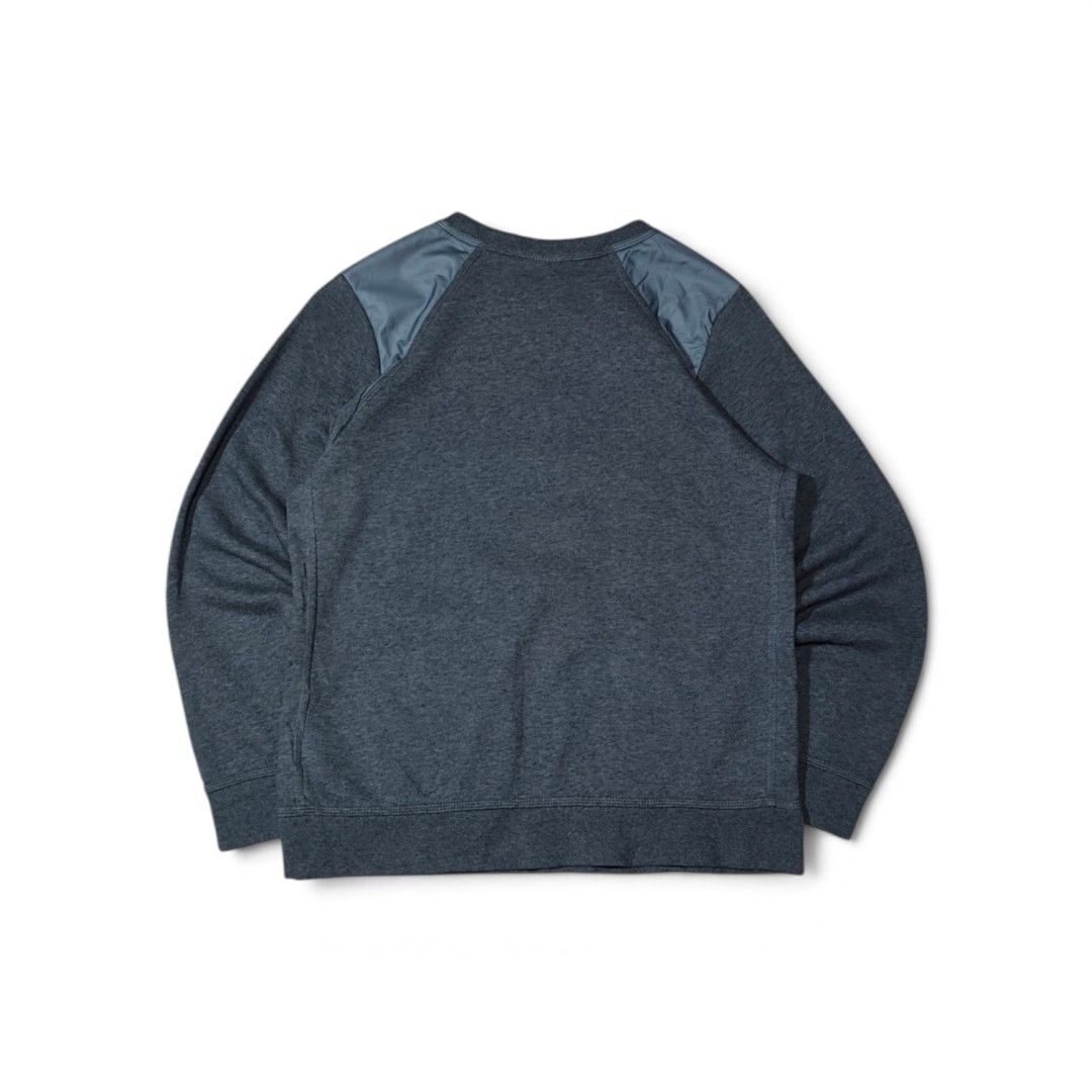 Nike Air Grey Blue Sweatshirt Jumper (Category: Coats, Jackets and Outerwear) located in Taguig. Submitted by lloydyy_thrift (Listing ID 1471006879, Image 2). Description: - Color: Dark grey marled with bright blue Nike Air chest graphic - Details: Contrast nylon shoulder patches for a stylish, utilitarian look - Fit: Classic crewneck with ribbed cuffs and hem - Material: Warm, soft, and comfortable fabric - Condition: Excellent pre-loved/new (re