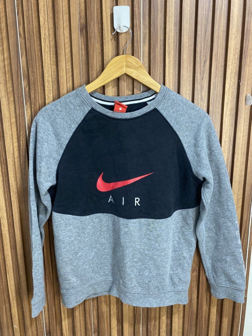 Nike Air Max 97 Grey Black Sweatshirt Size L (Category: Coats, Jackets and Outerwear) located in Caloocan City. Submitted by heatedcaps4425 (Listing ID 1471098641, Image 1). Description: - Brand: Nike - Color: Grey and black with red accents - Size: L (Standard fit) - Design: Red Air logo on chest, stacked Air Max 97 graphics and Japanese katakana text on sleeve - Details: Ribbed crewneck, cuffs, and hem - Interior: Soft and cozy fleece - Conditi