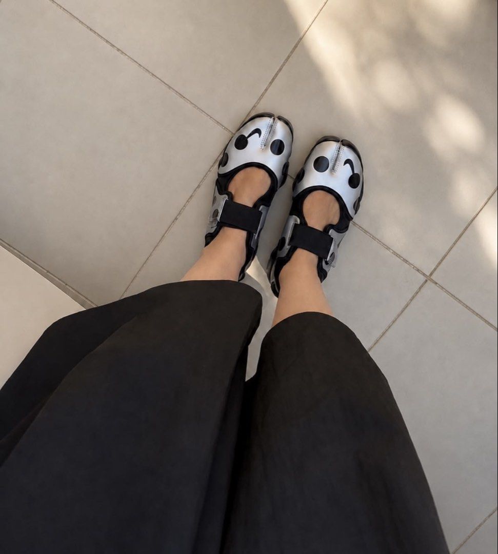 Nike Air Rift Polka Dot Silver Black (Category: Sneakers) located in Mandaluyong City. Submitted by meridaaa (Listing ID 1471085325, Image 3). Description: - Brand: Nike Air Rift - Color: Silver with black polka dots - Design: Iconic split-toe (tabi) silhouette with secure velcro straps - Sole: Chunky black rubber with Nike Air cushioning for extra comfort - Style: Avant-garde, perfect statement piece for your outfit **No box.