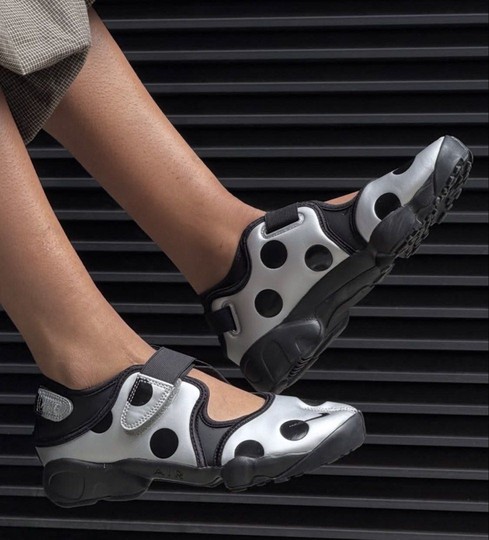 Nike Air Rift Polka Dot Silver Black (Category: Sneakers) located in Mandaluyong City. Submitted by meridaaa (Listing ID 1471085325, Image 2). Description: - Brand: Nike Air Rift - Color: Silver with black polka dots - Design: Iconic split-toe (tabi) silhouette with secure velcro straps - Sole: Chunky black rubber with Nike Air cushioning for extra comfort - Style: Avant-garde, perfect statement piece for your outfit **No box.