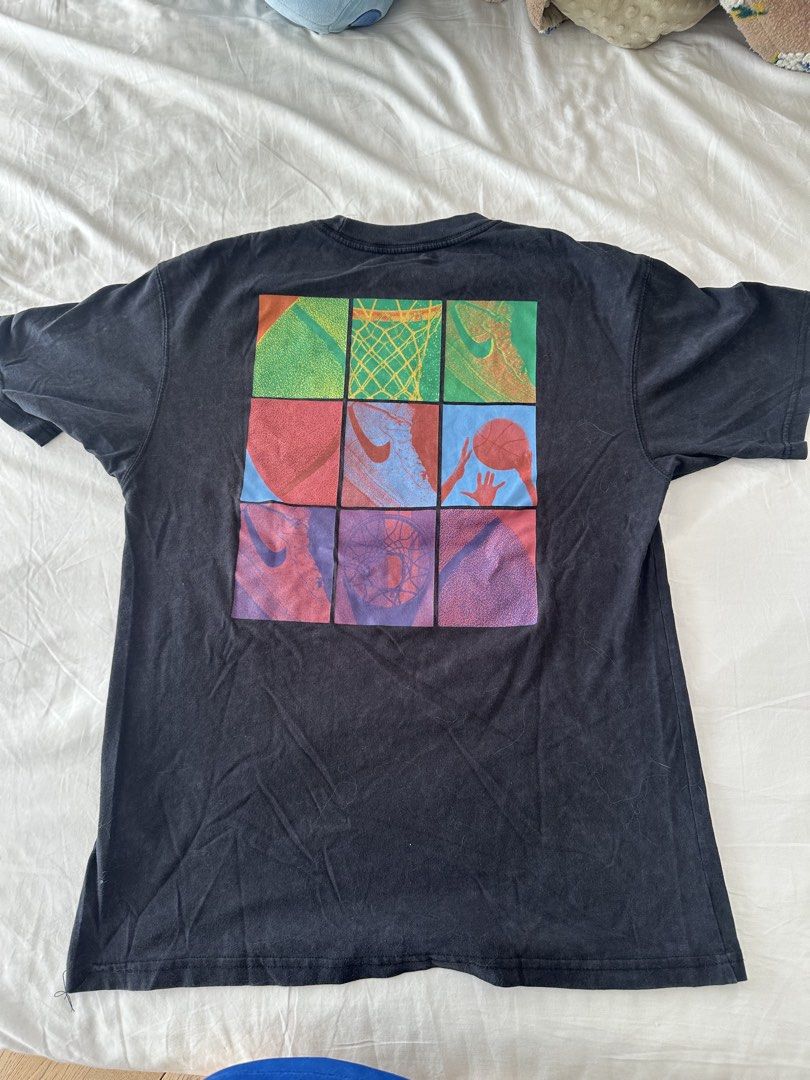 black nike basketball graphic tee (Category: Tshirts & Polo Shirts ) located in Quezon City. Submitted by 49diam (Listing ID 1470953673, Image 2). Description: - Brand: Nike - Color: Black - Size: Small - Material: Standard cotton - Design: Small basketball graphic with green swoosh on left chest, large vibrant 9-square basketball collage on the back - Fit: Casual crew neck - Condition: Excellent / Great for daily wear or basketball fans.