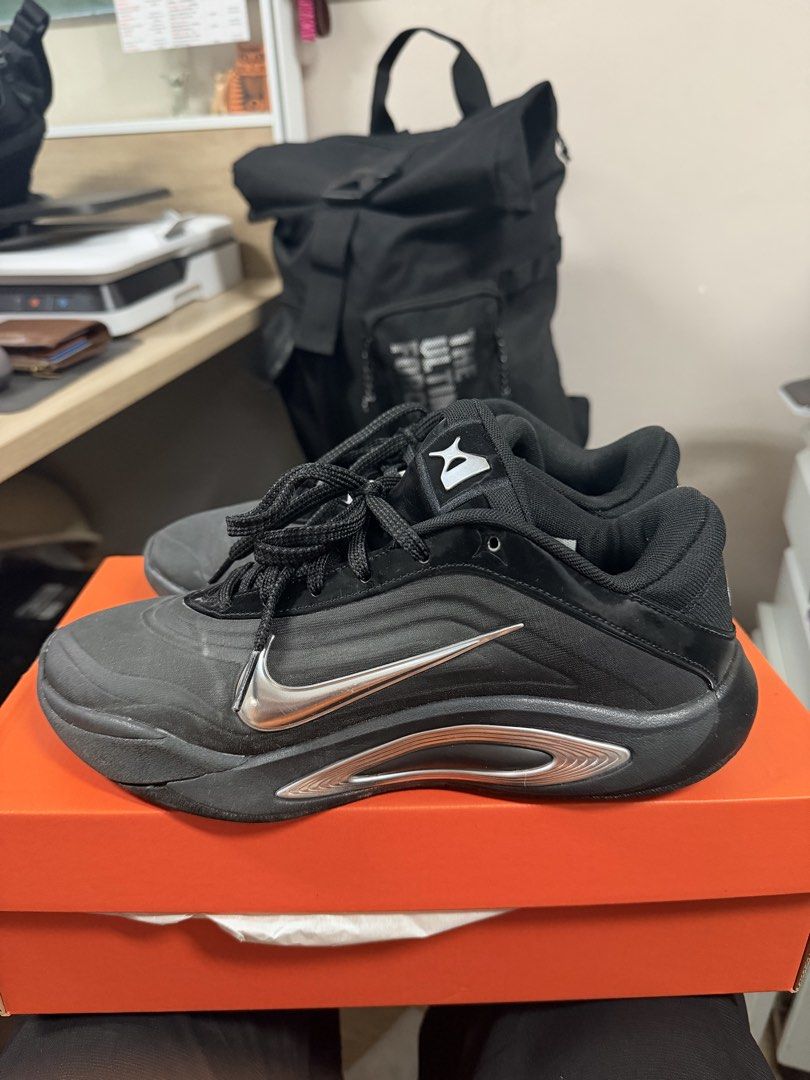 Nike Basketball Shoes (Category: Sneakers) located in Manila. Submitted by rubyannlucy (Listing ID 1470954462, Image 1). Description: Nike A’Ja Wilson Basketball Shoes for Womens - Colorway: Black and Chrome with metallic silver swoosh - Size: US 7 / UK 4.5 / EUR 38 - Condition: Preloved; in prestine condition - Details: Signature Aja Wilson.