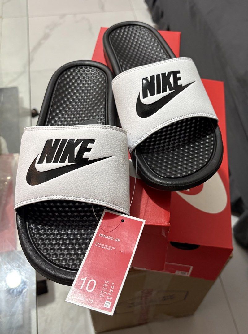 Nike Benassi JDI Men's Slides (Category: Slippers & Slides) located in Manila. Submitted by shoepatos4u (Listing ID 1470944069, Image 2). Description: Mens us8,9,10 available Slide into comfort in the lightweight and sporty Nike Benassi JDI Slide. It features the Nike logo on the foot strap, which is lined in super soft fabric. The foam midsole brings that beach feeling to your feet and adds spring to your kicked-back style. Benefits 1-piece, syn