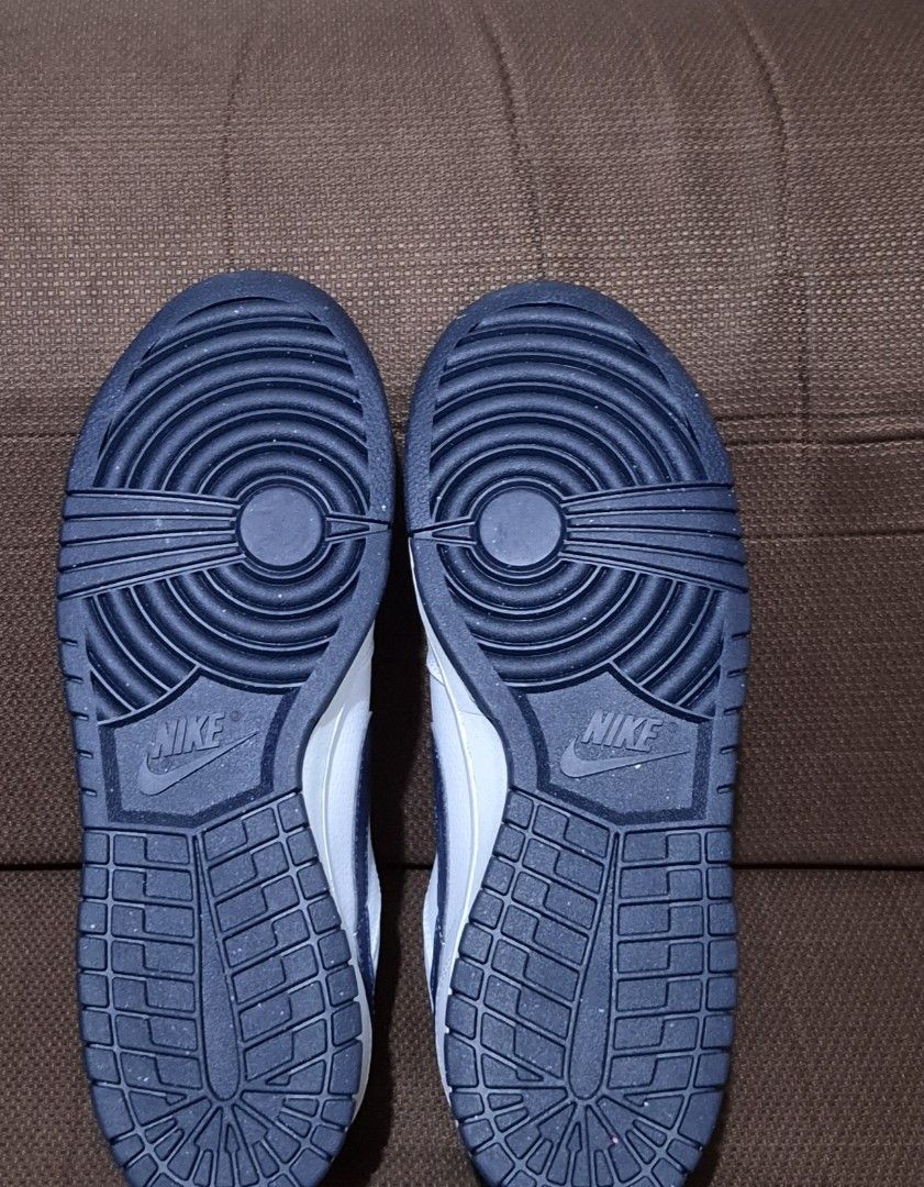Nike Big Low White Midnight Navy size 9.5 (Category: Sneakers) located in Manila. Submitted by jm1218 (Listing ID 1471051654, Image 2). Description: - Brand: Nike - Colorway: White and Navy Blue - Size: US 9.5 / UK 8.5 / EUR 43 / BR 41 / CM 27.5 - Material: Clean white leather upper with perforated toe box - Design Details: Navy blue accents on tongue tag, collar lining, and outsole - Sole: Classic rubber sole with circular traction pattern - Sty