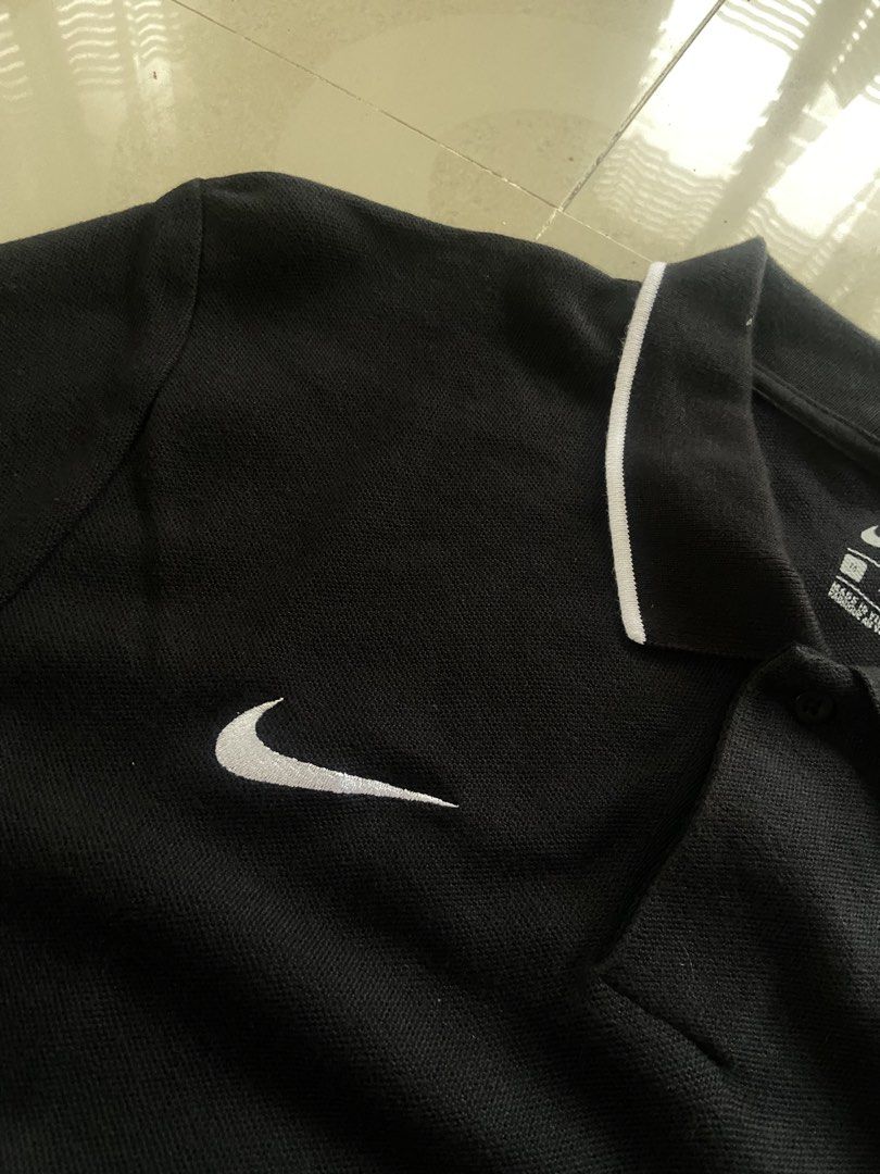 Nike Black Polo Shirt Size M (Category: Tshirts & Polo Shirts ) located in Manila. Submitted by noblehorse_f6bbe8 (Listing ID 1471063217, Image 3). Description: - Brand: Nike - Color: Black with white tipping on collar and cuffs - Size: Medium (M), Classic Fit - Material: 100% Cotton, Made in Vietnam - Logo: White embroidered Nike swoosh on right chest - Condition: Clean, great shape, ready to wear - Perfect for: Casual outings or sports.