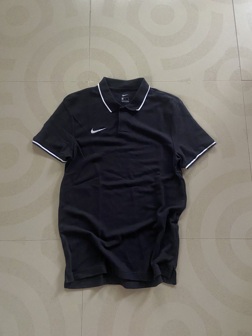 Nike Black Polo Shirt Size M (Category: Tshirts & Polo Shirts ) located in Manila. Submitted by noblehorse_f6bbe8 (Listing ID 1471063217, Image 1). Description: - Brand: Nike - Color: Black with white tipping on collar and cuffs - Size: Medium (M), Classic Fit - Material: 100% Cotton, Made in Vietnam - Logo: White embroidered Nike swoosh on right chest - Condition: Clean, great shape, ready to wear - Perfect for: Casual outings or sports.