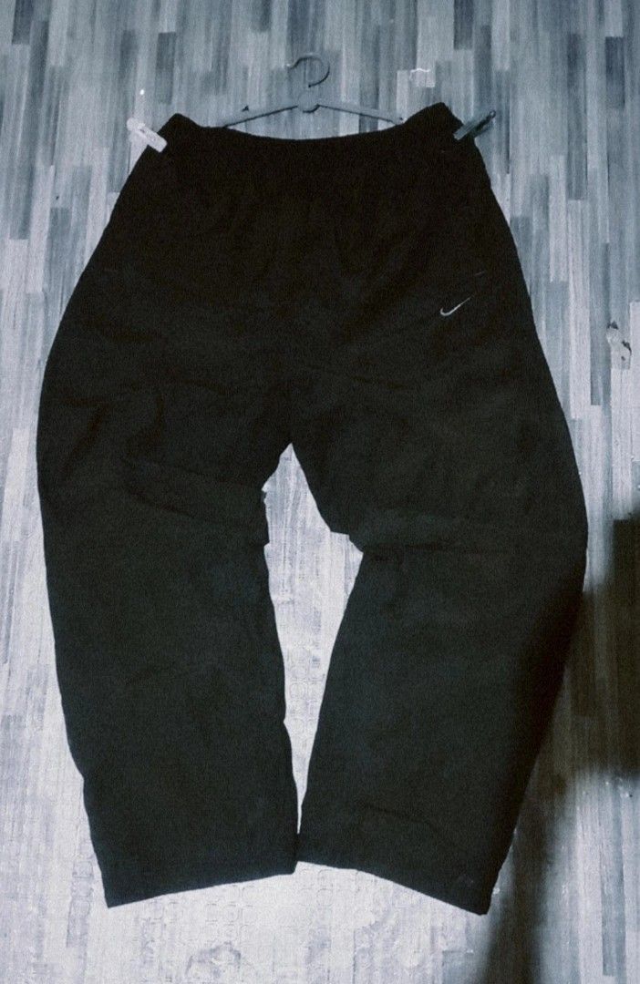 Nike Black Track Pants Sweatpants (Category: Joggers) located in Manila. Submitted by trayyoung (Listing ID 1470983793, Image 1). Description: - Brand: Nike - Fit: Relaxed fit through the legs with comfortable elastic waistband - Condition: Clean stitching, excellent everyday streetwear piece - Mode of Payment: GCash or COD available - Shipping: Ships via J&T Express.