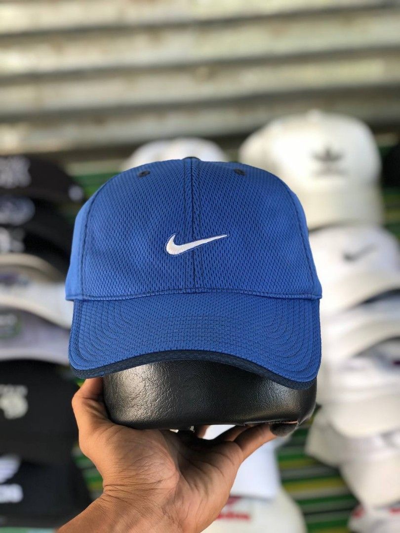 Nike Blue Mesh Cap with Just Do It Detailing (Category: Caps & Hats) located in Manila. Submitted by jowiegarci63146 (Listing ID 1470957913, Image 1). Description: - Color: Bright blue - Material: 100% breathable mesh polyester - Design: White embroidered Nike swoosh on the front - Details: 'JUST DO IT.' printed on the inner brim - Fit: Adjustable strap at the back (One Size Fits All) - Condition: Clean panels, ready to wear.