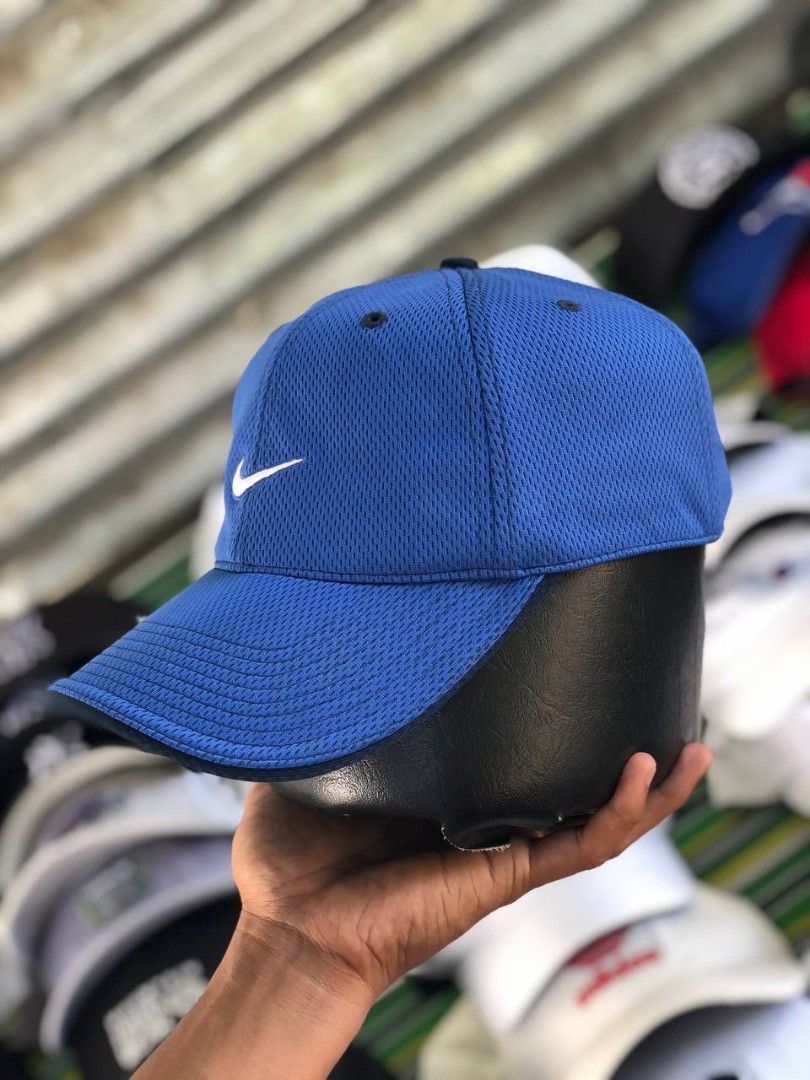 Nike Blue Mesh Cap with Just Do It Detailing (Category: Caps & Hats) located in Manila. Submitted by jowiegarci63146 (Listing ID 1470957913, Image 2). Description: - Color: Bright blue - Material: 100% breathable mesh polyester - Design: White embroidered Nike swoosh on the front - Details: 'JUST DO IT.' printed on the inner brim - Fit: Adjustable strap at the back (One Size Fits All) - Condition: Clean panels, ready to wear.