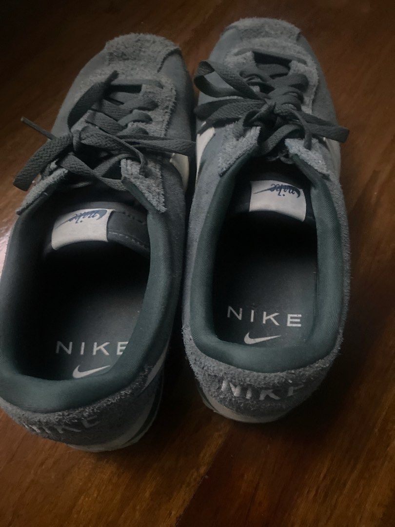 Nike Cortez Suede Green Sneakers (Category: Sneakers) located in Manila. Submitted by master02 (Listing ID 1470986042, Image 2). Description: - Brand: Nike - Model: Cortez Retro Runner - Color: Green Suede with White Swoosh and Laces - Details: Embroidered text logo on heel tabs, original tongue tags intact - Condition: Uppers in great textured suede condition; rubber outsole has minor dirt marks from light wear.