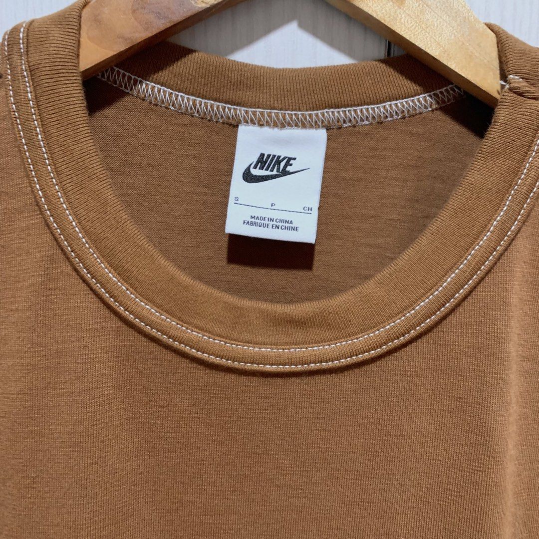 Nike Crew Neck Cotton T-shirt / Plain Tee Swoosh Patch (Category: Tshirts & Polo Shirts ) located in Mandaluyong City. Submitted by brandsforless.ph (Listing ID 1471009144, Image 3). Description: • Used once • Nike • Men’s T-shirts • Brown • Small • Chest: 94cm • Length: 67cm • 100% Cotton • Plain brown with Nike Swoosh patch at the bottom • Original Nike Brand • Please take note that some photos may have minimal difference in color due to lighti