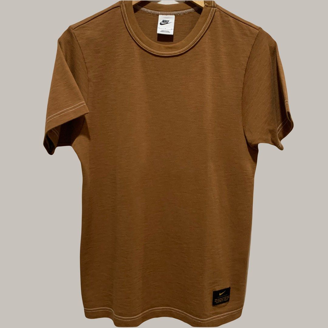 Nike Crew Neck Cotton T-shirt / Plain Tee Swoosh Patch (Category: Tshirts & Polo Shirts ) located in Mandaluyong City. Submitted by brandsforless.ph (Listing ID 1471009144, Image 1). Description: • Used once • Nike • Men’s T-shirts • Brown • Small • Chest: 94cm • Length: 67cm • 100% Cotton • Plain brown with Nike Swoosh patch at the bottom • Original Nike Brand • Please take note that some photos may have minimal difference in color due to lighti