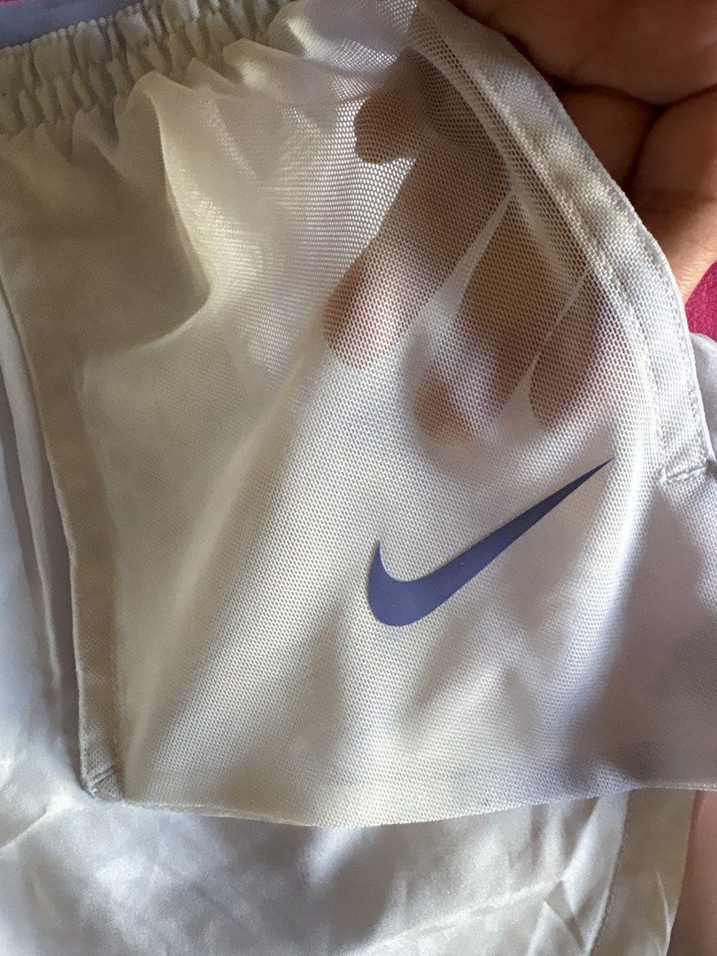 Nike Dri-FIT Running Shorts (Category: Activewear) located in Cainta. Submitted by PreLovedbyANM (Listing ID 1471009492, Image 3). Description: - Authentic Nike running shorts in purple and white - Size: Medium (tag inside) - Dri-FIT moisture-wicking fabric keeps you dry and comfortable - Built-in brief lining for extra support -Mesh pockets at front - Elastic waistband with adjustable Nike Running drawstring - Iconic Swoosh logo on the lower hem