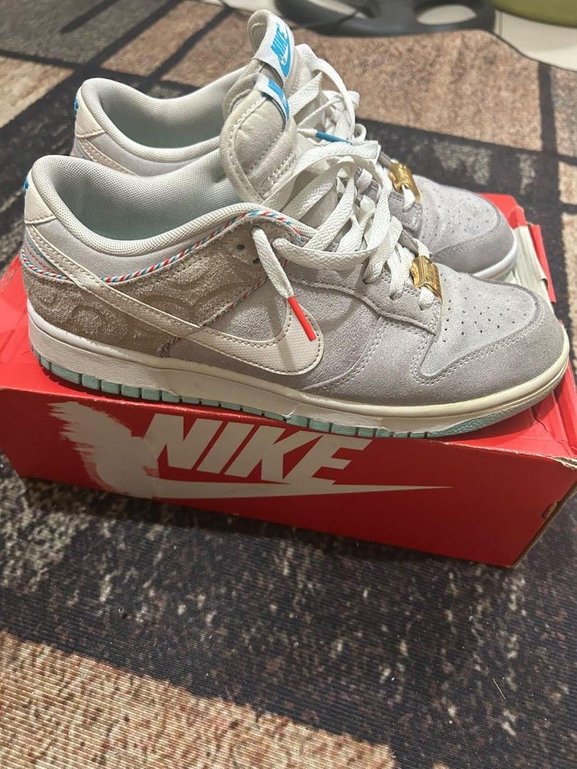 Nike Dunk Low Industrial Blue Barber Shop (Category: Sneakers) located in Manila. Submitted by andrew1517 (Listing ID 1471040998, Image 3). Description: - Model: Nike Dunk Low - Materials: Grey suede and white leather upper - Outsole: Light blue translucent rubber - Special Details: Gold hair clipper lace dubraes and striped heel collar piping - Inclusion: Original red Nike branded box - Condition: Brand new / Excellent (as applicable).