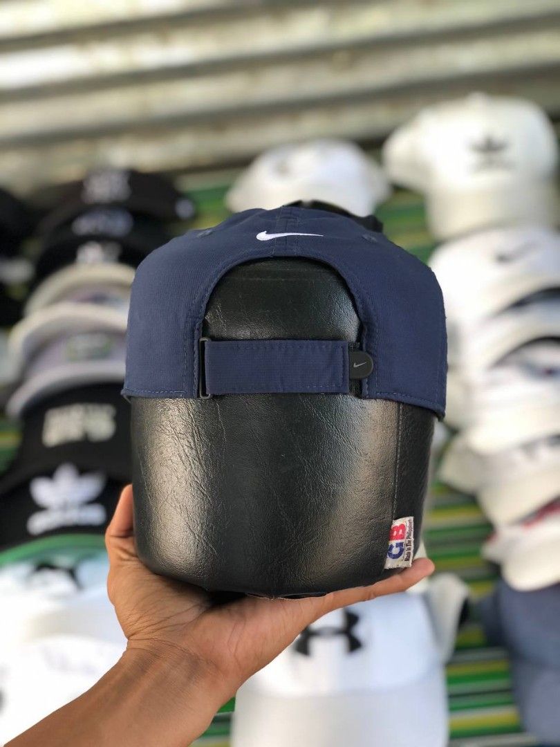 Nike Golf Navy Blue Baseball Cap (Category: Caps & Hats) located in Manila. Submitted by jowiegarci63146 (Listing ID 1470958226, Image 3). Description: - Color: Dark blue with white embroidered Nike swoosh - Material: 100% lightweight and breathable polyester - Fit: One size fits most with an adjustable back strap - Detail: Features a cute mini embroidered swoosh on the strap - Authentic Nike Golf gear (nikebetterworld.com tag).