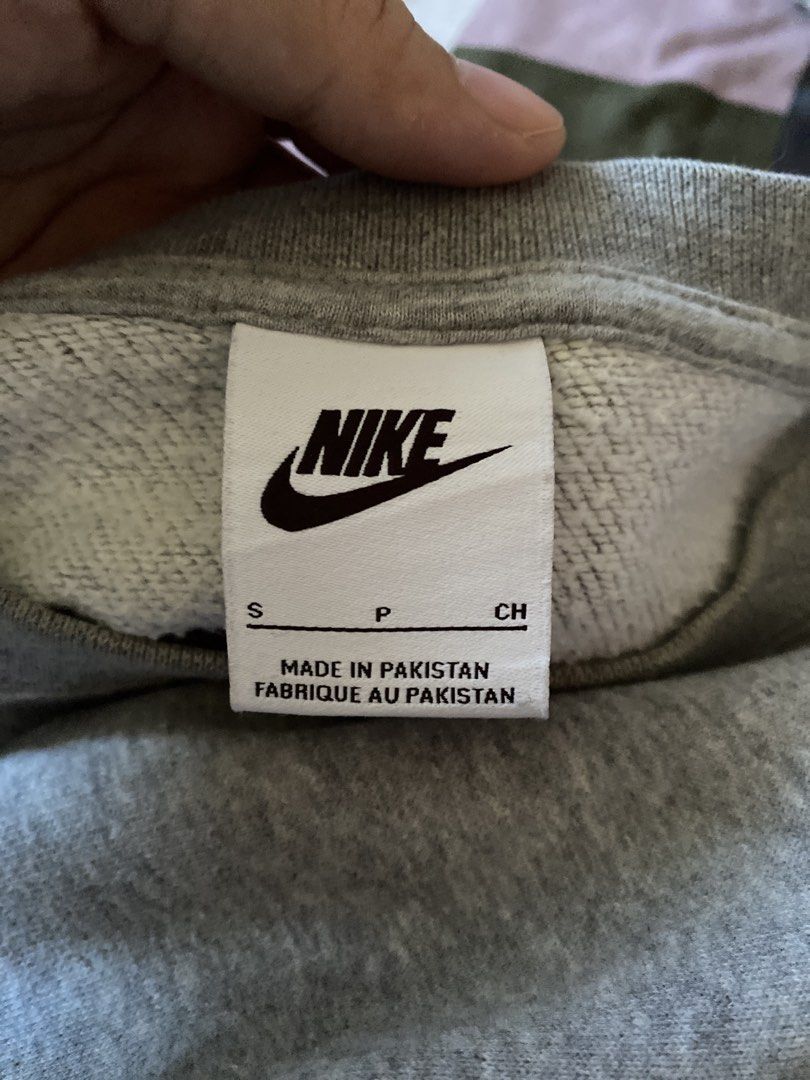 Nike Grey Cropped Sweatshirt (Category: Coats, Jackets and Outerwear) located in Manila. Submitted by love_mami (Listing ID 1470988777, Image 2). Description: - Brand/Model: Nike sweatshirt - Color: Grey - Size: Small on tag, runs big, best fit up to large frame - Design: Clean look with small embroidered logo on chest - Fit: Cropped style with long sleeves and ribbed cuffs - Condition: 9/10.