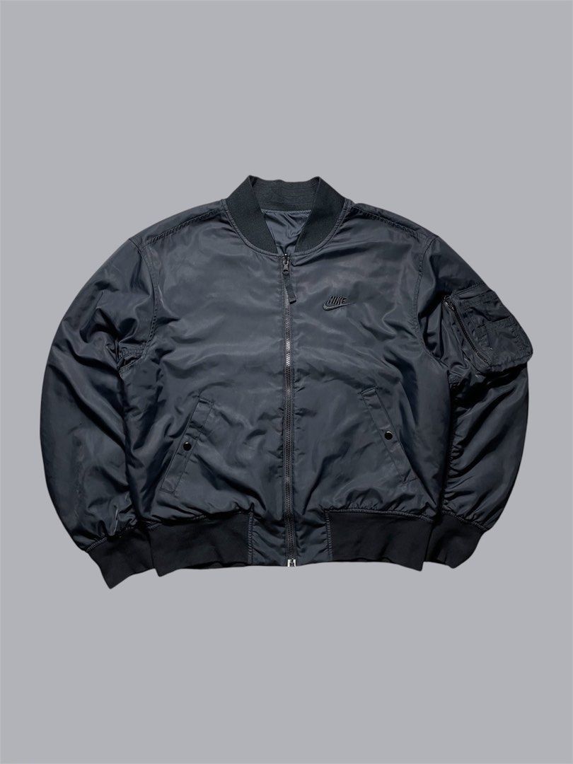 Nike Insulated Reversible Bomber Jacket (Category: Coats, Jackets and Outerwear) located in Caloocan City. Submitted by renowear (Listing ID 1470932923, Image 1). Description: Nike Insulated Reversible Bomber Jacket Excellent Condition Color Rate: 9.8/10 Issue: Not visible stain Authentic/Legit Measurements • Width: 23 • Length: 25 Price: 1500 obo DM IF INTERESTED📥.