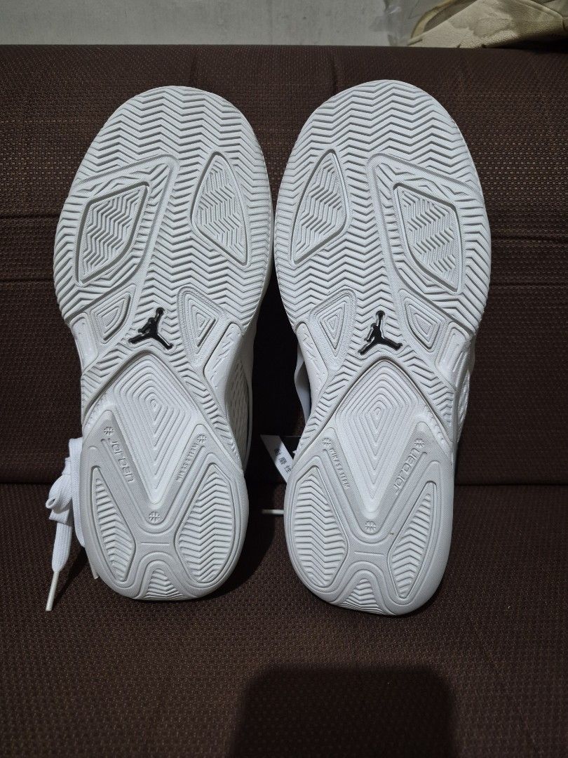 Nike Jordan White Sneakers Size US 6.5 (Category: Sneakers) located in Manila. Submitted by jm1218 (Listing ID 1471045835, Image 2). Description: - Brand: Nike Jordan - Color: Crisp White - Size: US 6.5 / EUR 37.5 - Condition: Fresh out of the box, zero wear on tread - Features: Classic hoops design, iconic Jumpman branding, and comfortable padded collar.