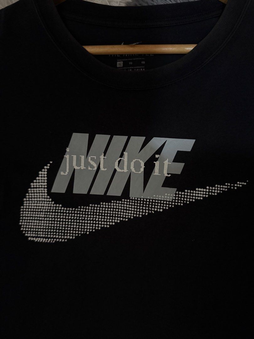 Nike Just Do It Graphic Tee Black Size XL (Category: Tshirts & Polo Shirts ) located in Manila. Submitted by keepercollection (Listing ID 1471054966, Image 3). Description: - Authentic Nike Sportswear t-shirt in classic black - Large 'Just Do It' graphic print and swoosh design on the chest - Cool repeated small swoosh logos on the sleeve - Features woven Nike label at the bottom hem - Pit-to-pit: ~22.5 inches - Length: ~29.5 inches.