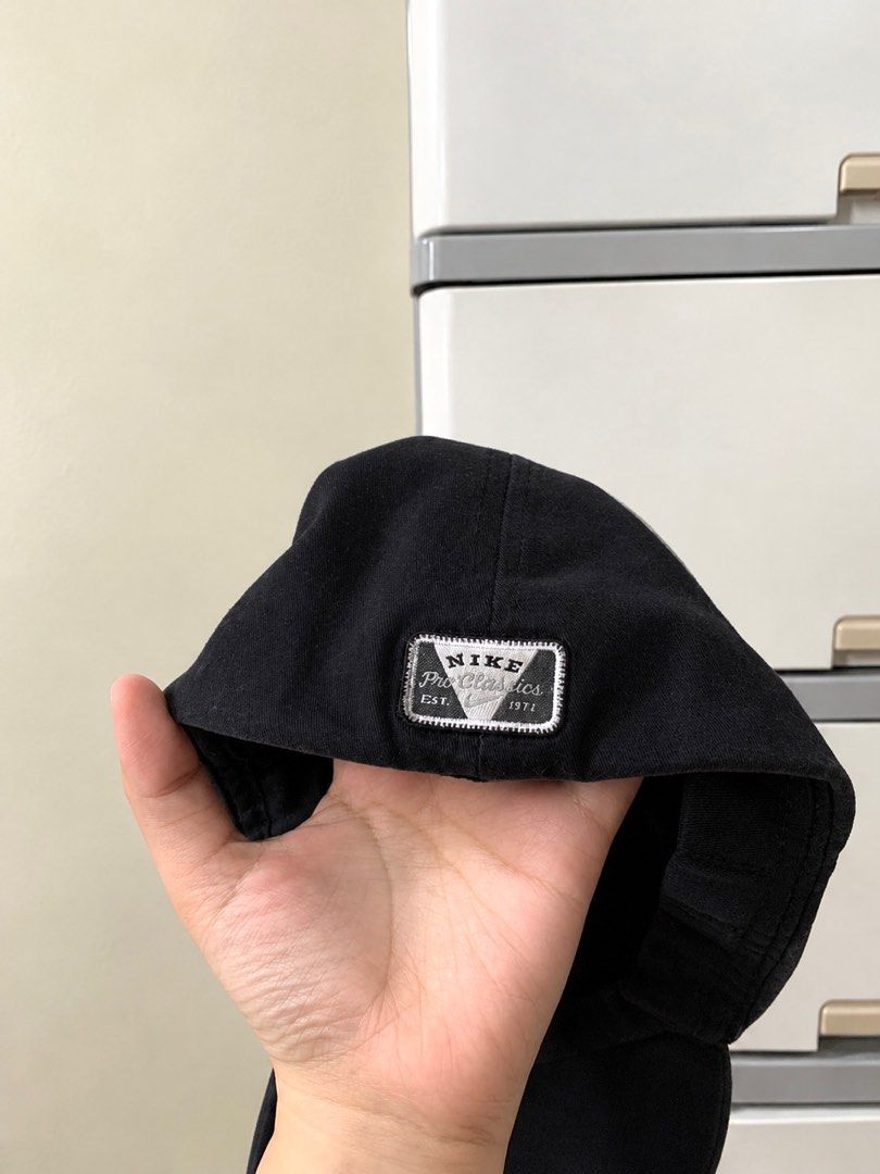 Nike Pro Classics Black Baseball Cap (Category: Caps & Hats) located in General Trias. Submitted by julescraftyspace (Listing ID 1470979983, Image 2). Description: - Color: Classic Black - Brand: Nike (with embroidered white swoosh) - Design: Six-panel structure with a curved brim - Authenticity: Nike Pro Classics label stitched inside - Fit: Adjustable strap closure at the rear - Condition: Clean, fresh, and ready to wear for sports or daily out