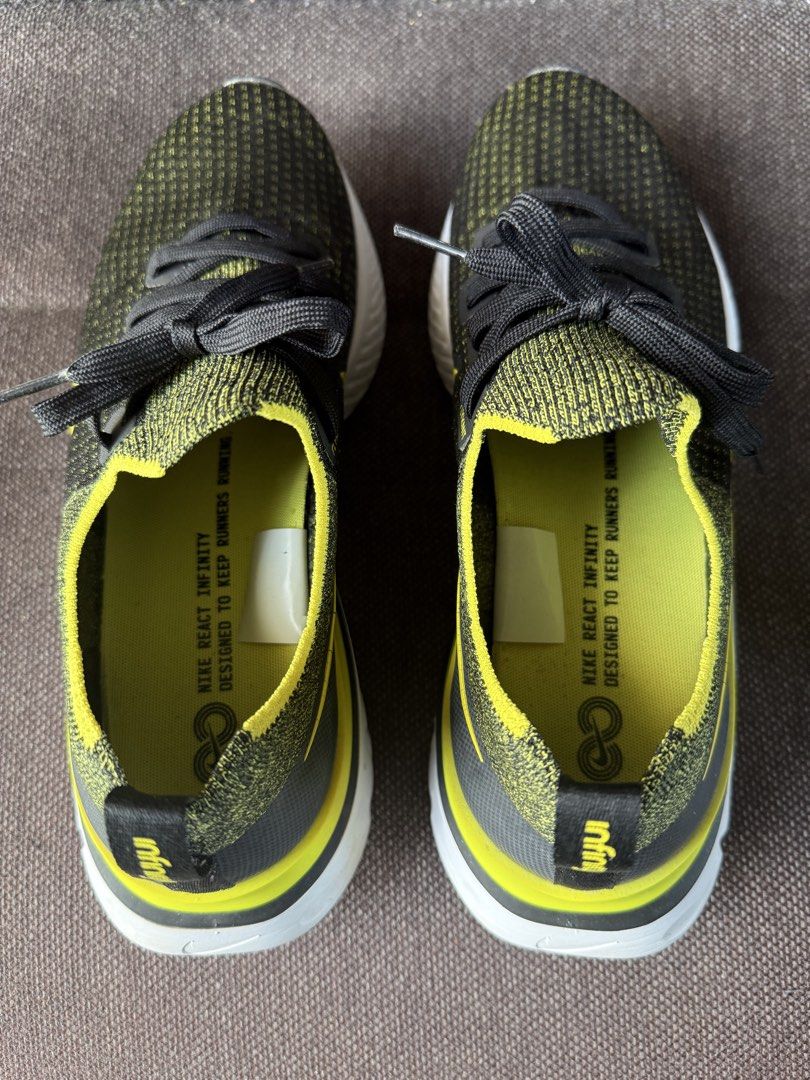 Nike React Infinity Flyknit Black Yellow US 9.5 (Category: Sneakers) located in Iloilo. Submitted by darvoza (Listing ID 1470961987, Image 2). Description: Nike React Infinity Run Flyknit sneakers. Black and yellow colorway with white midsoles. Size US 9.5, UK 8.5, EUR 43, CM 27.5. Sock-like flyknit upper construction, cushioned react foam sole. Clean outsoles, barely any wear on the tread. Original size tag intact inside..