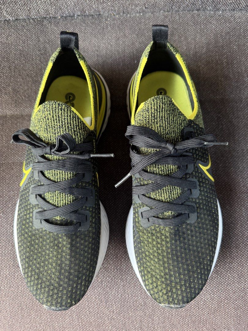 Nike React Infinity Flyknit Black Yellow US 9.5 (Category: Sneakers) located in Iloilo. Submitted by darvoza (Listing ID 1470961987, Image 3). Description: Nike React Infinity Run Flyknit sneakers. Black and yellow colorway with white midsoles. Size US 9.5, UK 8.5, EUR 43, CM 27.5. Sock-like flyknit upper construction, cushioned react foam sole. Clean outsoles, barely any wear on the tread. Original size tag intact inside..