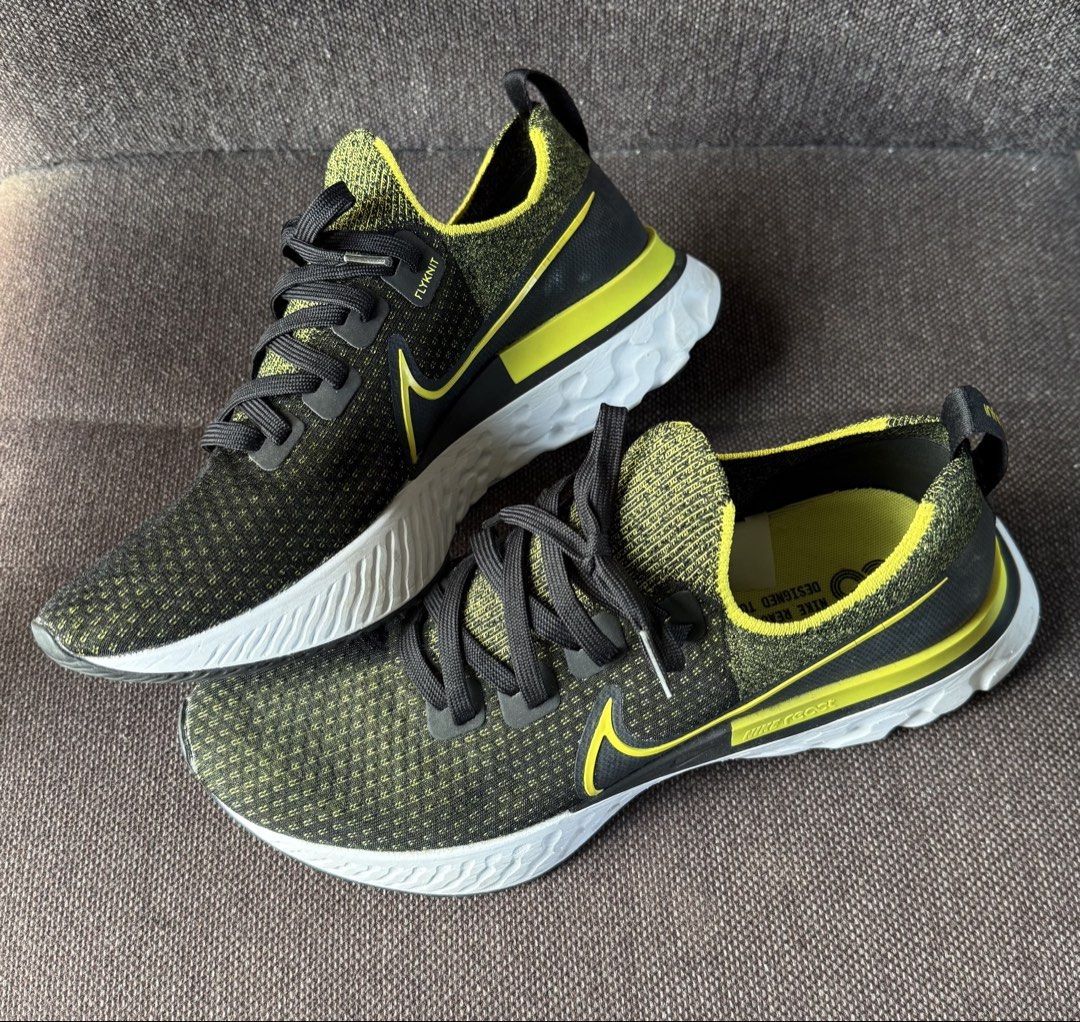 Nike React Infinity Flyknit Black Yellow US 9.5 (Category: Sneakers) located in Iloilo. Submitted by darvoza (Listing ID 1470961987, Image 1). Description: Nike React Infinity Run Flyknit sneakers. Black and yellow colorway with white midsoles. Size US 9.5, UK 8.5, EUR 43, CM 27.5. Sock-like flyknit upper construction, cushioned react foam sole. Clean outsoles, barely any wear on the tread. Original size tag intact inside..