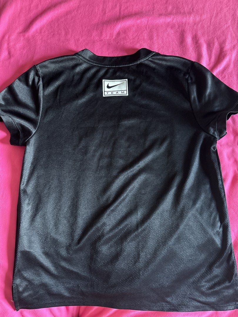 Nike Running Dri-FIT Black Tshirt (Category: Activewear) located in Cainta. Submitted by PreLovedbyANM (Listing ID 1471011556, Image 2). Description: - Brand: Nike - Item: Running T-Shirt - Color: Black - Size: Large - Material: Dri-FIT moisture-wicking fabric - Details: Varsity-style logo on chest, Nike Team patch on back collar, taped interior neck branding - Condition: Great athletic or casual top - Origin: Made in Vietnam No COD No other chec
