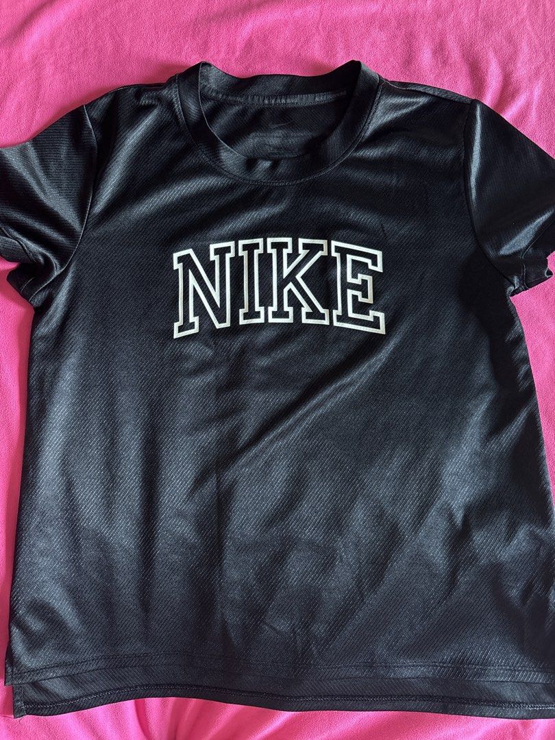 Nike Running Dri-FIT Black Tshirt (Category: Activewear) located in Cainta. Submitted by PreLovedbyANM (Listing ID 1471011556, Image 1). Description: - Brand: Nike - Item: Running T-Shirt - Color: Black - Size: Large - Material: Dri-FIT moisture-wicking fabric - Details: Varsity-style logo on chest, Nike Team patch on back collar, taped interior neck branding - Condition: Great athletic or casual top - Origin: Made in Vietnam No COD No other chec