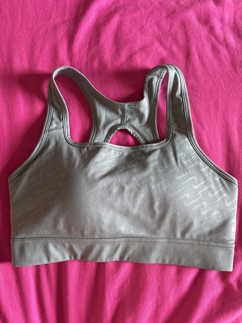 Nike Sports Bra (Category: Activewear) located in Cainta. Submitted by PreLovedbyANM (Listing ID 1471015781, Image 1). Description: - Brand: Nike - Color: sage / greenish gray - Size: Large - Technology: Dri-FIT fabric keeps you dry and cool - Design: Racerback with a stylish keyhole cutout - Band: Comfortable elastic underband featuring a pink Nike swoosh logo on the back Worn once Issue - stitch at the back (see pic) Rfs - too tight for me No C