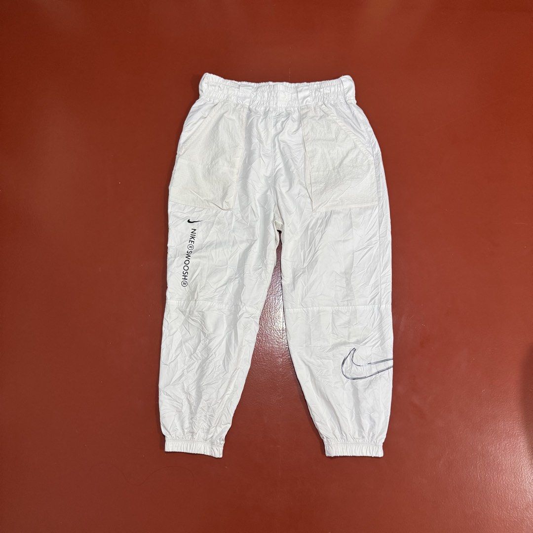 NIKE SWOOSH WOVEN PANTS (Category: Joggers) located in Pasig City. Submitted by buzzthrifty (Listing ID 1471001729, Image 1). Description: SIZE 30-38WAIST 36LENGTH EXCELLENT CONDITION .