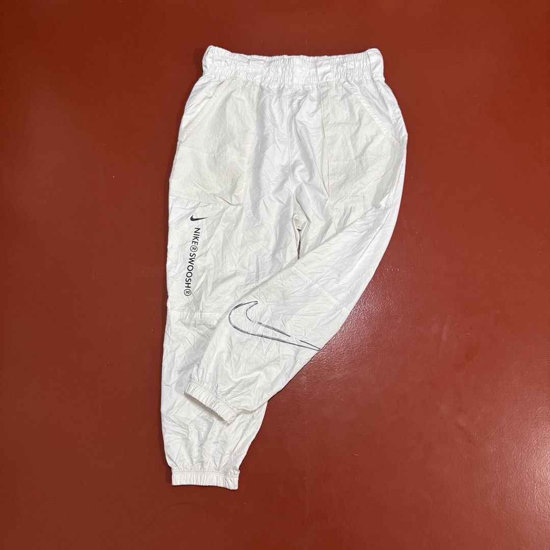 NIKE SWOOSH WOVEN PANTS (Category: Joggers) located in Pasig City. Submitted by buzzthrifty (Listing ID 1471001729, Image 3). Description: SIZE 30-38WAIST 36LENGTH EXCELLENT CONDITION .