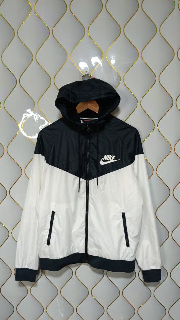 Nike Windrunner Hooded Jacket Black White (Category: Coats, Jackets and Outerwear) located in Manila. Submitted by zariyah.1986 (Listing ID 1470982673, Image 1). Description: - Authentic Nike Windrunner jacket in a timeless black and white colorway - Size: L (Made in Vietnam) - Measurements: 23" width x 26" length - Full zip front with an attached hood for extra coverage - Two secure zipped side pockets - Breathable mesh inner lining - Lightweigh