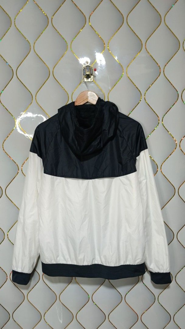 Nike Windrunner Hooded Jacket Black White (Category: Coats, Jackets and Outerwear) located in Manila. Submitted by zariyah.1986 (Listing ID 1470982673, Image 2). Description: - Authentic Nike Windrunner jacket in a timeless black and white colorway - Size: L (Made in Vietnam) - Measurements: 23" width x 26" length - Full zip front with an attached hood for extra coverage - Two secure zipped side pockets - Breathable mesh inner lining - Lightweigh