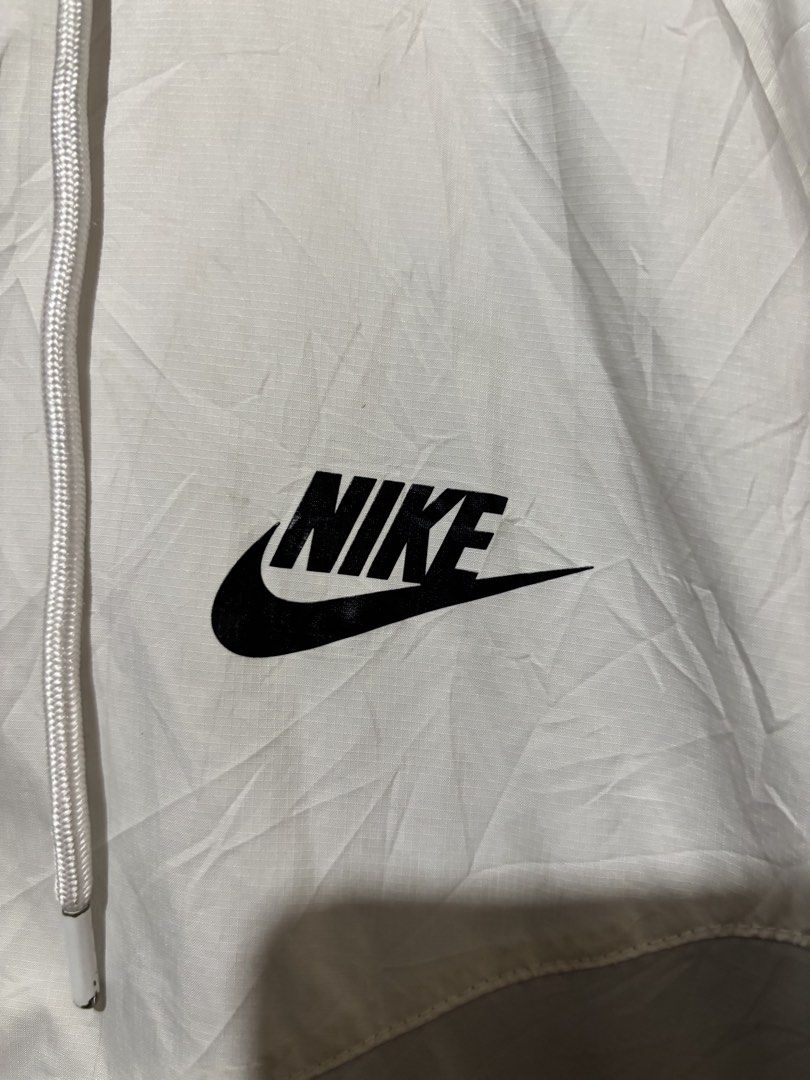 Nike Windrunner Hooded Jacket Light Blue White (Category: Coats, Jackets and Outerwear) located in Lopez. Submitted by thrift.ni.roms22 (Listing ID 1471053701, Image 3). Description: - Authentic Nike windrunner jacket in a stylish white, grey, and light blue colorblock design - Lightweight and breathable material, ideal for workouts or breezy days - Full zip front with an adjustable hood and drawstrings - Secure zippered front pockets for your es