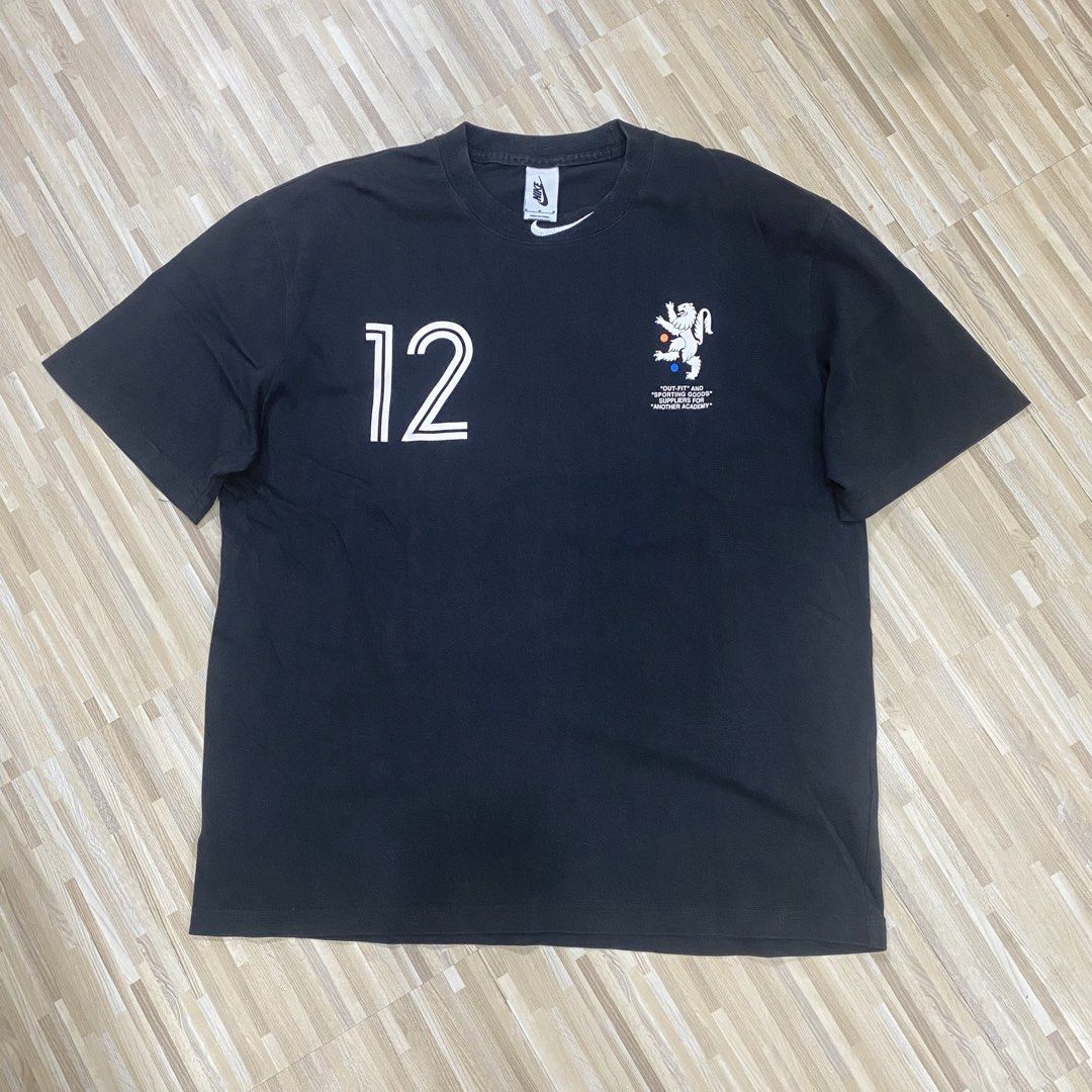 Nike x Off-White Eagle Graphic Black T-Shirt (Category: Tshirts & Polo Shirts ) located in Manila. Submitted by scapethrift (Listing ID 1470973682, Image 2). Description: - Color: Black - Material: 100% Cotton - Fit: Regular fit, classic crew neck with short sleeves - Front Details: Number '12' and lion crest print - Back Details: Large white Nike swoosh and eagle graphic - Condition: Tag and size label intact.