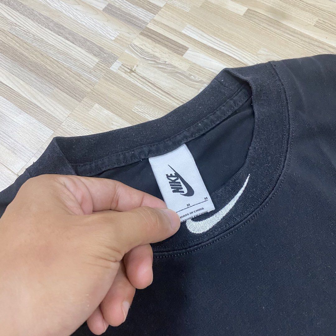 Nike x Off-White Eagle Graphic Black T-Shirt (Category: Tshirts & Polo Shirts ) located in Manila. Submitted by scapethrift (Listing ID 1470973682, Image 3). Description: - Color: Black - Material: 100% Cotton - Fit: Regular fit, classic crew neck with short sleeves - Front Details: Number '12' and lion crest print - Back Details: Large white Nike swoosh and eagle graphic - Condition: Tag and size label intact.