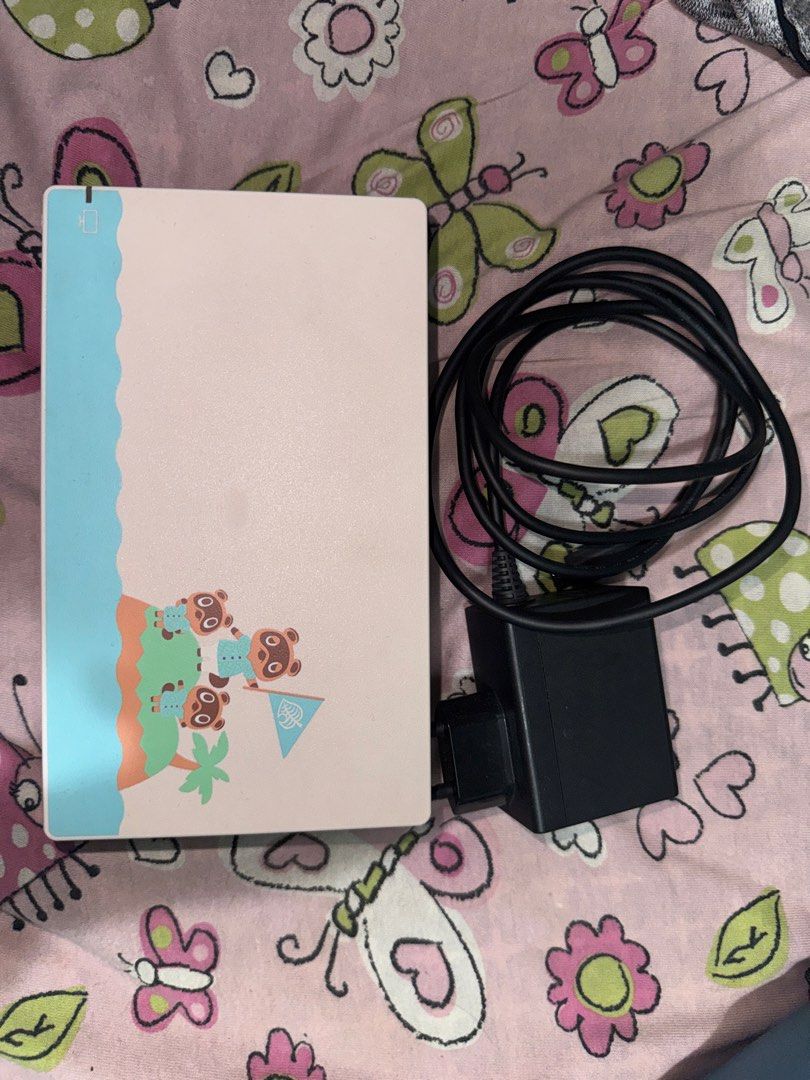 Nintendo Switch Animal Crossing Edition (Category: Nintendo) located in Cainta. Submitted by clengy612 (Listing ID 1471094666, Image 3). Description: - Special Edition Animal Crossing Nintendo Switch console - Pastel green and blue joy-cons attached - Custom dock with cute island graphics - Includes 128GB SanDisk microSD card and original power adapter - Screen has minor wear - 100% working condition and powers up normally Negotiable price RFS: M