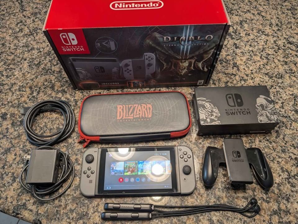 Nintendo Switch Diablo III • Limited Edition Console Bundle (Category: Nintendo) located in San Pablo. Submitted by nathanzvg (Listing ID 1470953369, Image 1). Description: Condition: Good Status: Available 🟢 Nintendo Switch Diablo III Limited Edition with 32GB storage and Diablo-themed design. Supports handheld, tabletop, and TV gaming. Pre-owned in good condition. Includes original box, dock, Joy-Cons, grip, straps, charger, HDMI cable, and Di