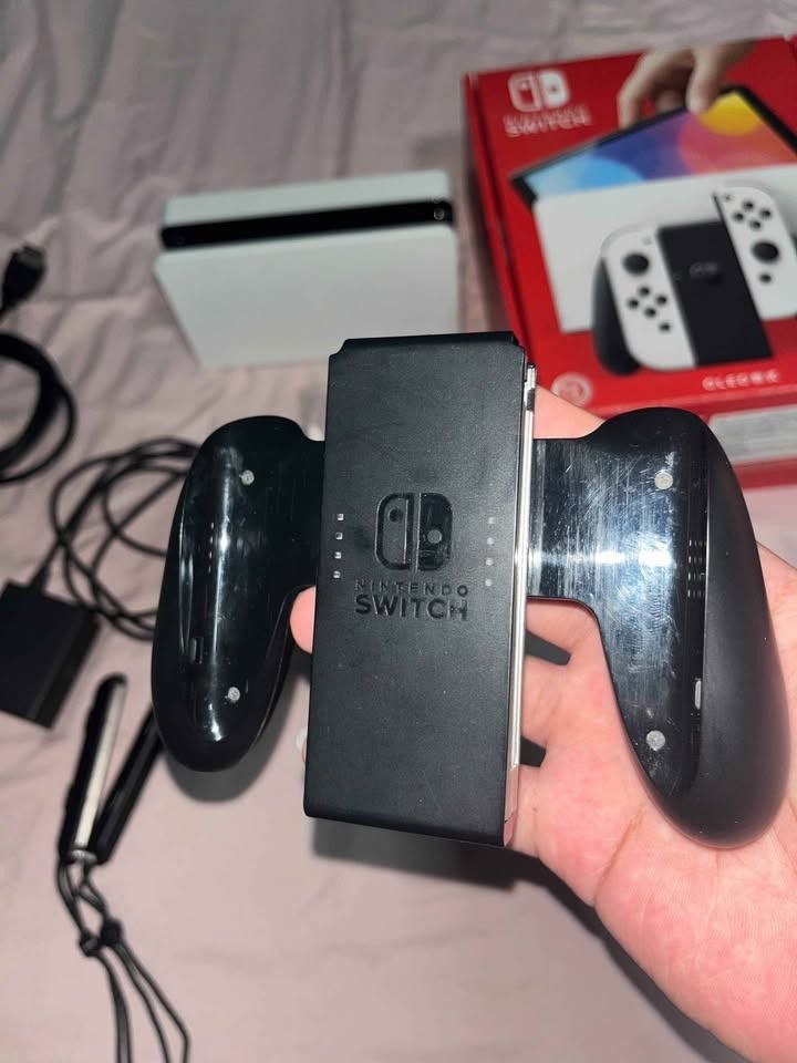Nintendo Switch OLED (Category: Nintendo) located in Pasay City. Submitted by safeturtle.eabb46 (Listing ID 1470992122, Image 3). Description: Selling Nintendo Switch Oled Complete with Box (Non JB) Inclusion • Switch Console • Joycons • Dock • Hdmi (Not original) • AC Adapter • Joycons Grip • Joycons Wrist Strap Can do meet up nearby or halfway pasay area .