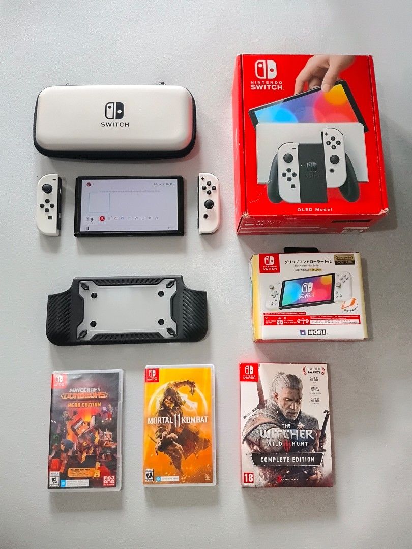Nintendo Switch OLED Model White with Games and Accessories (Category: Nintendo) located in Marikina City. Submitted by heydjsm (Listing ID 1471071358, Image 1). Description: RUSH SALE SWITCH OLED BUNDLE Switch OLED in brand new condition complete with box and original nintendo accessories NO ISSUES, LIKE BUYING A NEW SWITCH Selling all for 20k only GAMES AND ACCESSORIES worth 13k -Mario Kart 8 Deluxe -2595 -The Witcher 3 Limited Edition Rare -24